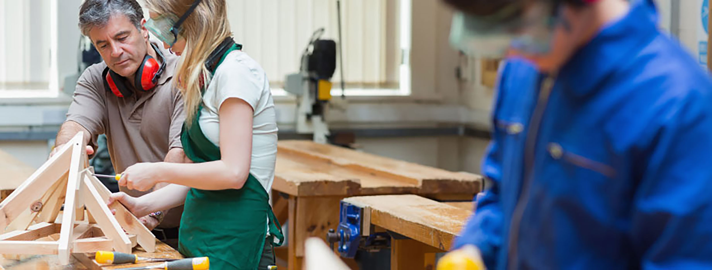 Students building a project in a classroom.