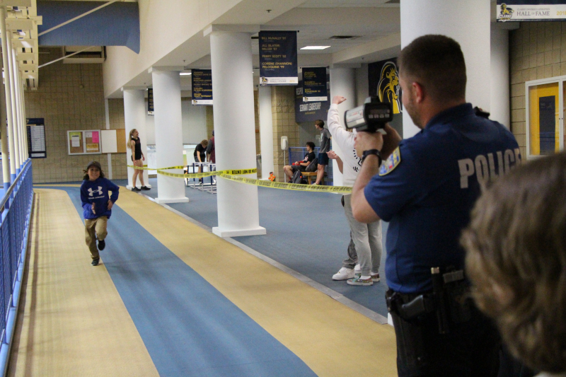 Police doing radar gun tracking.