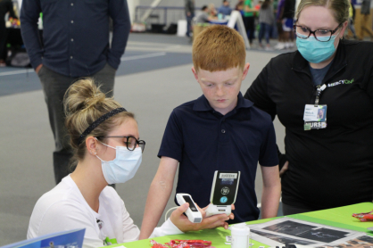 MercyOne nurse working with kids.